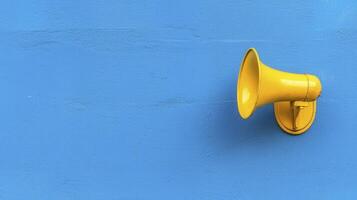 Vibrant Yellow Megaphone on a Deep Blue Background A Powerful Visual for Announcements, Marketing, and Communications, Offering a Clear Message, Attention-Grabbing Appeal, Ideal for Promotions, News photo