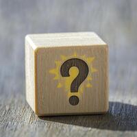 Unveiling the Mystery A Captivating Image of a Wooden Block Adorned with a Question Mark Symbol, Sparking Curiosity and Inviting Contemplation Explore the Depths of Inquiry as You Delve into the photo