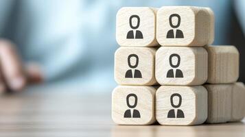 Unlock human potential and build stronger teams with these wooden block icons showcasing unity and collaboration, symbolizing the power of people working together towards a shared goal, fostering photo