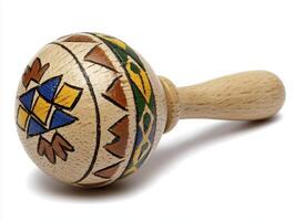 Hand-Painted Wooden Rattle with Geometric Patterns photo