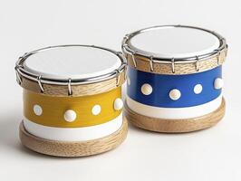 Small Yellow and Blue Toy Drums with White Polka Dots photo