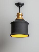 Textured Black and Gold Pendant Lamp with Warm Light photo