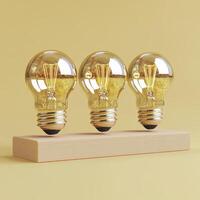 Three Glowing Lightbulbs on Wooden Block photo