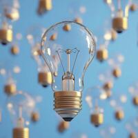 Floating Glass Lightbulb with Gold Base Against Blue Background photo