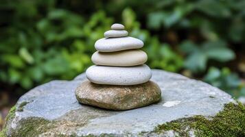 Balanced Stones on Mossy Rock in Peaceful Nature photo