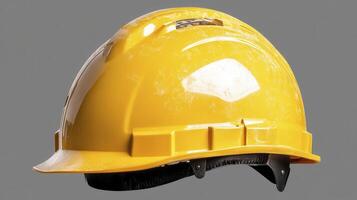 Dusty Yellow Hard Hat on Grey Background photo