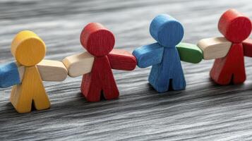Colorful Wooden Figures Holding Hands in Unity photo