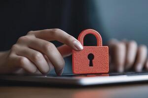 Red Padlock on Laptop Digital Security Concept photo