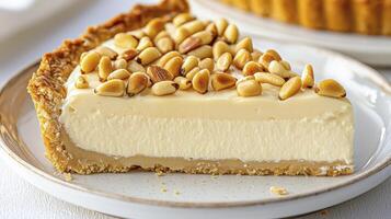 Indulge in the creamy delight of a slice of pine nut tart, a dessert masterpiece that combines the richness of custard with the nutty crunch of toasted pine nuts, perfect for any occasion, from photo