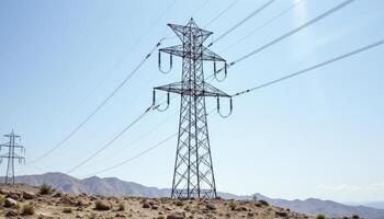 High-voltage power lines stretch across a barren, sun-drenched landscape, pylons standing tall against the clear blue sky Electrical towers transmit energy, connecting urban centers and rural photo