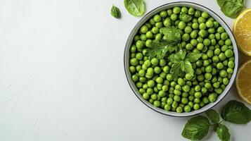 Fresh Green Peas in Bowl with Lemon Wedges A Vibrant Culinary Image Showcasing the Beauty of Natural Food, Healthy Eating, and the Simplicity of a Nutritious Diet Ideal for Blogs About Vegan Recipes photo