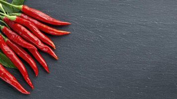 Explore the vibrant world of red chili peppers with this captivating image, showcasing their fiery allure and culinary potential Discover the rich textures, intense colors, and spicy essence that photo