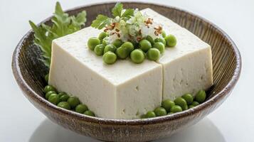 Explore the Creamy Delight of Tofu A Culinary Adventure with Fresh Peas and Delicate Green Onions, Showcasing the Versatility and Nutritional Power of Plant-Based Protein in a Harmonious Composition photo