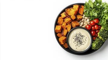 Delicious and Nutritious Plant-Based Power Bowl A Vibrant Image Showcasing a Healthy Meal Featuring Roasted Sweet Potatoes, Fresh Greens, Cherry Tomatoes, Broccoli Florets, and a Creamy Sesame Seed photo
