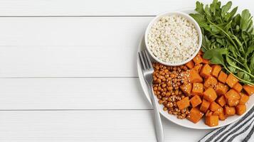 Discover the vibrant world of healthy eating with this captivating image showcasing a balanced plate of nutritious ingredients, featuring sweet potatoes, lentils, rice, and fresh arugula, all photo