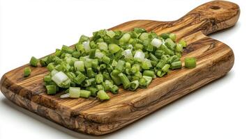 Discover vibrant culinary delight with this high-resolution image showcasing freshly chopped green onions, meticulously arranged on a rustic wooden cutting board A testament to freshness, this photo