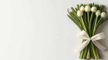 Elegant Still Life Photograph of a Minimalist Tulip Bouquet Capturing the Essence of Spring with Fresh Green Stems and Pure White Petals Tied with a Delicate Cream Ribbon, Perfect for Greeting Cards photo
