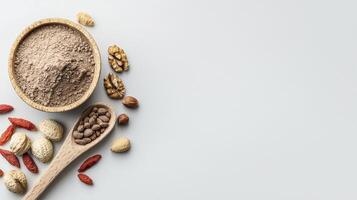 Elevate your culinary creations and nourish your well-being with this captivating image showcasing an array of wholesome ingredients, from nutrient-rich powders to crunchy nuts and vibrant goji photo