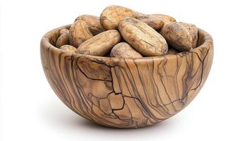 Elevate your designs with this high-quality image of cocoa beans in a rustic wooden bowl, perfect for food blogs, culinary websites, or any project seeking an organic and natural touch These raw photo