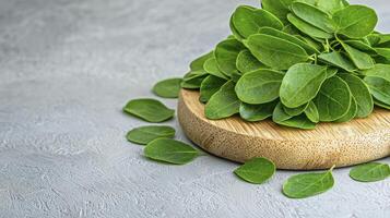 Fresh Green Purslane Leaves on Wooden Board A Vibrant Close-Up Showcasing the Succulent Texture and Bright Color of This Nutritious Leafy Green, Perfect for Healthy Recipes, Salads, and Culinary photo
