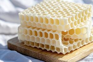 Captivating Honeycomb Stack A Close-Up Image Showcasing the Intricate Beauty of Nature's Design Explore the geometric precision and delicious sweetness embodied within these hexagonal cells photo