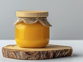 Capture the golden glow of homemade honey, radiating warmth and natural sweetness A close-up image showcasing the jar filled with pure honey, evoking feelings of nostalgia and wholesome goodness photo