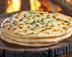 Delicious Garlic Naan Bread Recipe A Cheesy, Fluffy Delight Baked to Perfection over an Open Fire Experience Authentic Indian Cuisine with this Homemade Recipe, Perfect for Sharing with Friends and photo