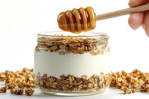 Delicious Honey Yogurt Parfait with Crunchy Granola A Healthy and Nutritious Breakfast or Snack Idea, Perfect for a Quick and Easy Meal Enjoy the Sweetness of Natural Honey Combined with Creamy photo