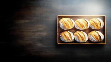 A generous tray of freshly baked bread loaves ready to be served as a delicious addition to any meal or gathering photo