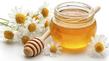 Discover the Golden Elixir A Captivating Image of Natural Honey in a Glass Jar, Surrounded by Delicate White Chamomile Flowers, Accented with a Wooden Honey Dipper Explore the Sweetness, Health photo