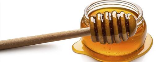 Golden Honey Delight A Close-Up Capture of Sweetness and Light, Showcasing a Glass Jar Filled with Natural Honey, Accompanied by a Wooden Honey Dipper, Dripping with its Delicious Contents This Image photo