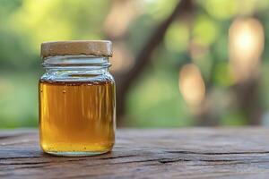Golden Honey in a Glass Jar A Close-Up Still Life Photograph Capturing the Rich Texture and Warm Color of Natural Honey, Perfect for Culinary or Wellness Projects Explore the Health Benefits and photo