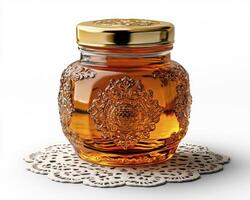 Golden Honey Jar A Close-Up View of a Decorative Glass Container Filled with Natural Sweetener, Perfect for Breakfast, Baking, or a Healthy Treat, Displayed on a Delicate White Doily, Emphasizing photo