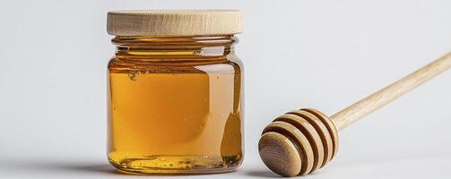 Golden Honey in Glass Jar with Wooden Dipper A Close-Up Shot Showcasing Natural Sweetener, Perfect for Healthy Eating and Delicious Recipes Capturing the Essence of Sweetness, this Image Depicts a photo