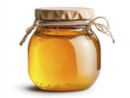 Golden Honey Jar Still Life A high-quality image of a classic honey jar, capturing the rich, amber color of the honey and the rustic charm of its packaging Perfect for illustrating concepts related photo