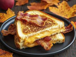 Indulge in the ultimate comfort food experience with this mouthwatering grilled cheese sandwich featuring crispy bacon and gooey melted cheese Perfect for a cozy autumn day, this classic dish is photo