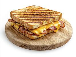 Indulge in the Ultimate Grilled Cheese Sandwich A Mouthwatering Culinary Delight featuring Crispy Bacon, Melted Cheddar Cheese, and Perfectly Toasted Bread This Classic Comfort Food is elevated to photo