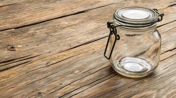 Rustic Charm Capturing the Essence of Vintage Empty Glass Jars on Weathered Wood, perfect for showcasing organic textures and vintage aesthetics Discover the timeless appeal of glass jars paired with photo