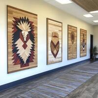 A captivating corporate hallway showcases native artwork, adding a touch of cultural richness and visual interest to the professional environment The hallway features a series of framed pieces, each photo