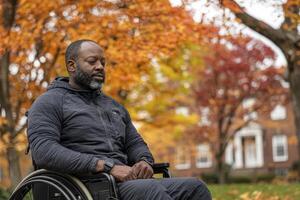 Amidst a picturesque autumn landscape, a man in a wheelchair is deeply engrossed in his training regimen, leveraging the power of a smart fitness tracker to monitor his progress This data-driven photo