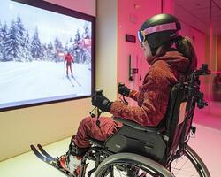 An athlete in a wheelchair utilizes an indoor ski simulator, showcasing innovation in sports training This advanced technology offers adaptive athletes the opportunity to experience the thrill of photo