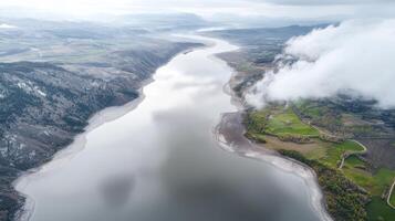 Captured from a high vantage point, the intricate network of waterways forms a mesmerizing delta, its veins resembling delicate brushstrokes on the earth's canvas The abstract perspective highlights photo