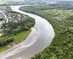From a bird's-eye view, a sprawling river delta unfolds, an aquatic tapestry woven with precision Countless waterways snake and intertwine, creating nature's artistic expression The delta's intricate photo