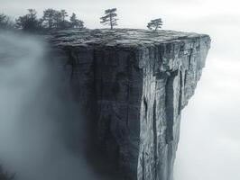 In a realm where stone meets sky, a rugged rock formation emerges, draped in a veil of ethereal fog The untouched landscape whispers secrets of ancient times, its mysterious aura captivating the soul photo