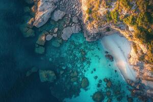 Secluded Cove Aerial View of Turquoise Waters and Rocky Cliffs photo