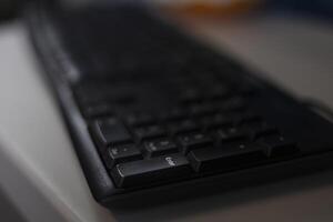 Close up View Of A Enter Key On The Black Computer Keyboard photo
