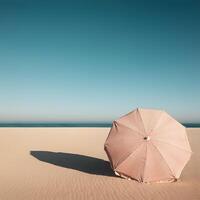 A Beach scene with single striped umbrella on golden sand under clear blue sky summer travel vacation relaxation concept photo