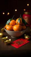 Fresh tangerines with green leaves in a ceramic bowl golden ingots red envelope symbolize prosperity luck Chinese New Year photo