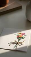 Elegant minimalist empty card copy space for text with tied flower bouquet in soft natural sunlight casting delicate shadows photo