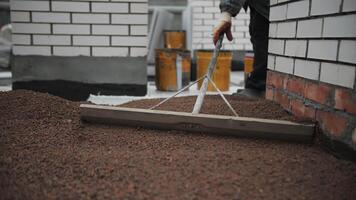 Leveling Expanded Clay on House Roof Surface video